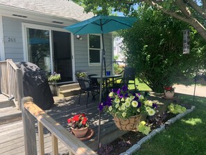 Flowers, shade. Umbrella table. 