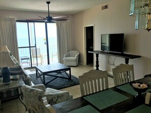 Welcome home! 
 Viewing dining and living area to balcony.  