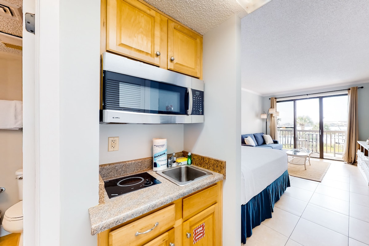 Cozy coastal efficiency with kitchenette, balcony with sound views & pool