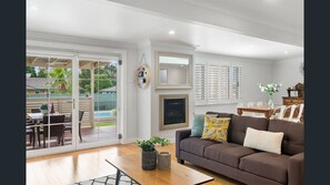 Light open plan room with access to outdoor covered area
