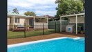 Rear yard with covered area, pool and lovely grassed area