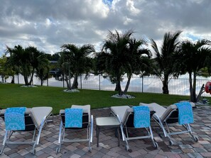 Private Waterfront Pool with Comfortable Lounges