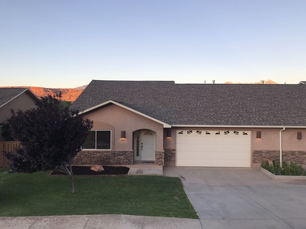 Front of house at sunset.