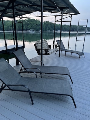 beach lounge chairs and swing are on the dock for your use