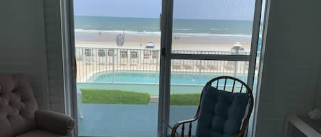 living area looking at ocean and patio