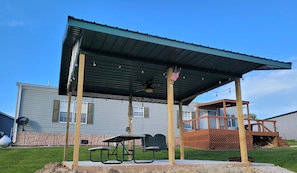 Shelter, table, and swing added 5/13/22. Cement, fan & lights added on 6/20/22