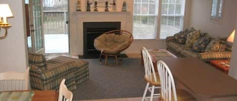 Family Room #1, center kitchen island, dining room & deck. Colorfully decorated!