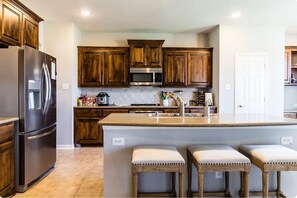 Large kitchen with stainless steel appliances