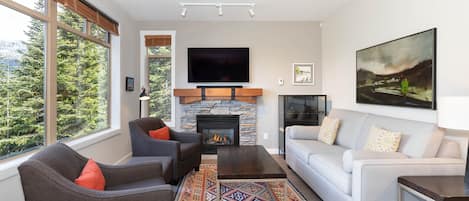 Cozy living room with gas fireplace and TV