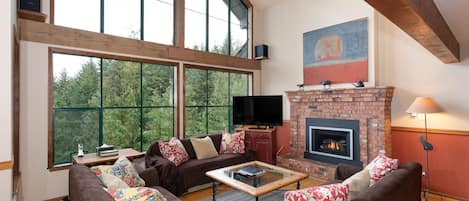 Cozy living room with floor to ceiling windows