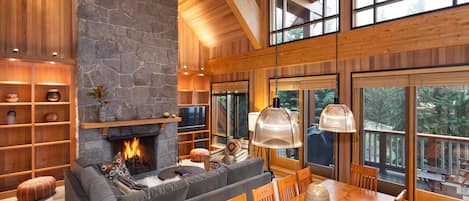 Open concept living room with log fireplace