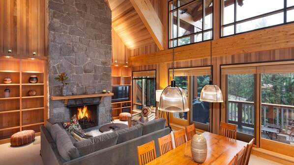 Open concept living room with log fireplace