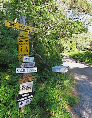 Old-fashioned signboard marks the entrance to our private lane
