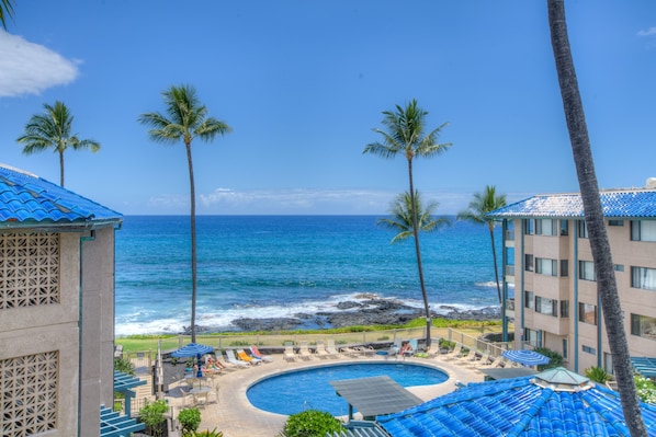 Actual View from Lanai of Unit F-11 over the Pool Area to the Ocean beyond.