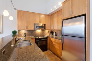 Contemporary kitchen with granite countertops and stainless steel appliances