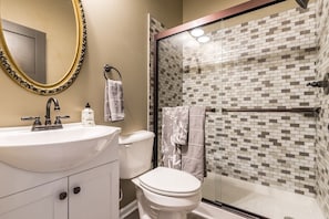 The tile work in this stand up shower has it all.  No shortage of luxury.