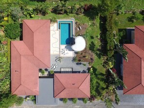 bird eye view of the villa, pool and garden.