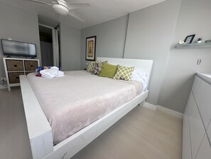 Ample sleeping area with king bed with SmartTV.