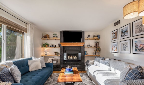 Welcome to your newly redecorated modern cowboy cottage. Relax in the heart of the home, our cozy living room with chic country decor. Kindly note the fireplace is not in use due to safety purposes.
