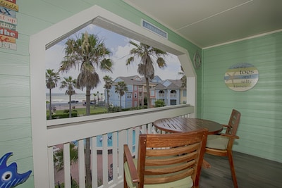 Galveston meets Key West in this Beach Condo...Steps to Galveston Beach and Bay!