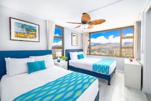 The bedroom features 1 queen-size bed, 1 full-size bed and ceiling fan. Enjoy the beautiful mountain views from your bedroom window!
