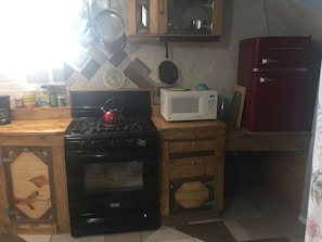 Gas stove, microwave, and mini fridge