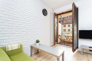 The living room leads out onto a balcony. 