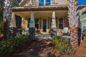 Charming front porch with a swing for morning coffee!