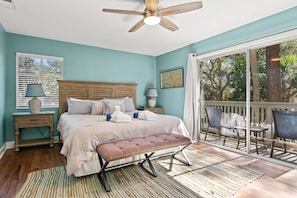 Primary bedroom with king bed, smart TV, private balcony and private attached bathroom