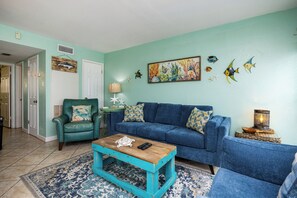 Unwind in this comfy living area with a queen size sleeper sofa