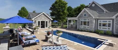 Heated pool, poolhouse, ping pong table, corn hole