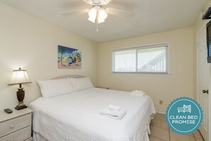 Master bedroom with king size bed and flat screen TV