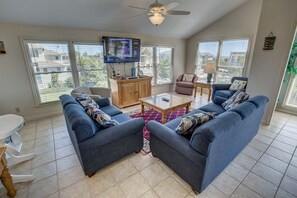 Top-Level Living Room with Deck Access ** The high chair seen in photos is no longer at the property. If baby equipment is needed local rental options can be provided. **