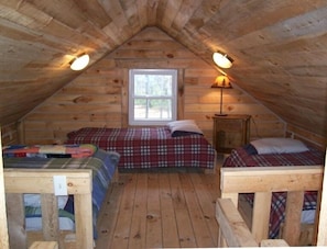 Half of the double loft sleeping area