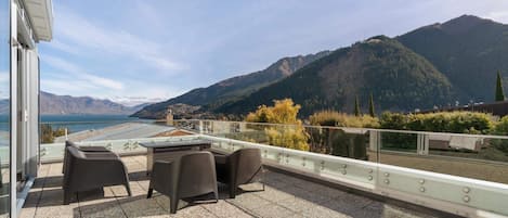 Outdoor balcony with mountain and lake views