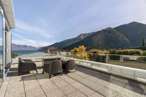 Outdoor balcony with mountain and lake views