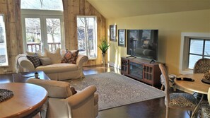 Bright. Airy. Mock fireplace/heater.  Balcony with seating for 2. 