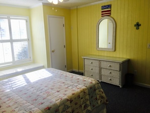 Master bedroom with closet and chest of drawers 