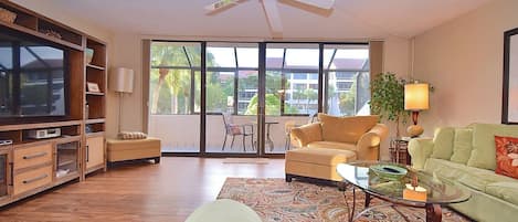 Living room opens up to screened large screened lanai