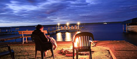 Lakeside lawn and fire pit.
