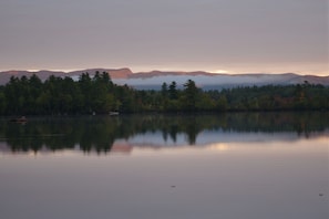 Sunrise reflecting on hills to the north.