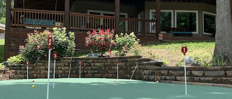 Enjoy mini-golf (15 x 28 feet) at a luxury waterfront lakehouse.