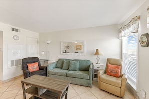 Living area with full size sleeper sofa and comfy recliners