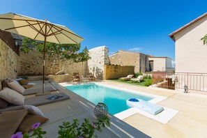 Pool terrace with lawn covered area!