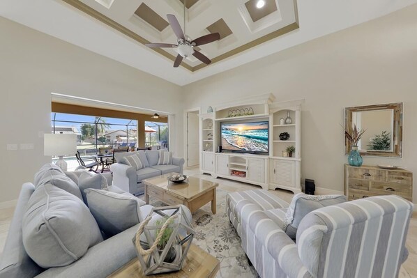 The bright and modern Living area has been decorated in cool beach themed tones