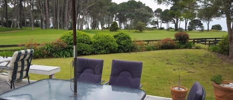 View of golf course and ocean from deck