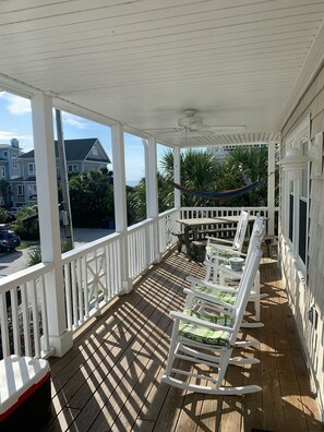 Wide wrap around front porch with 4 rockers, bistro set, picnic table & swing. 