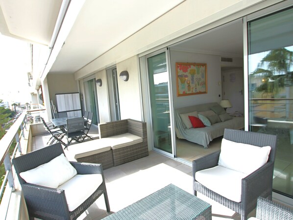 large terrace, lounge area and dining table