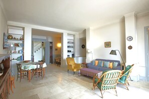 Bright air conditioning living room with dining and lounge area