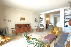 Bright air conditioning living room with dining and lounge area